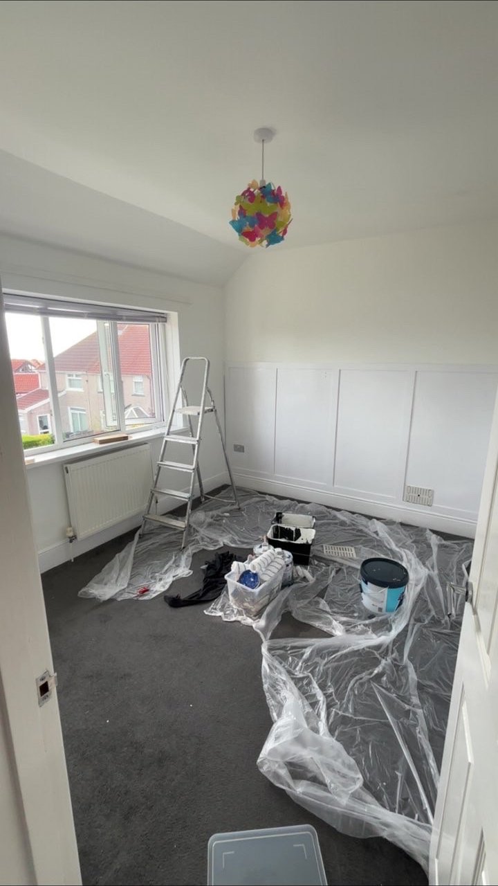 Bedroom panelling finished in crisp white by Linden Decorators