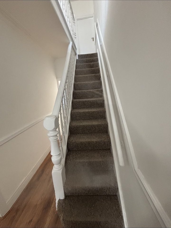 Stairs and landing repainted in crisp white